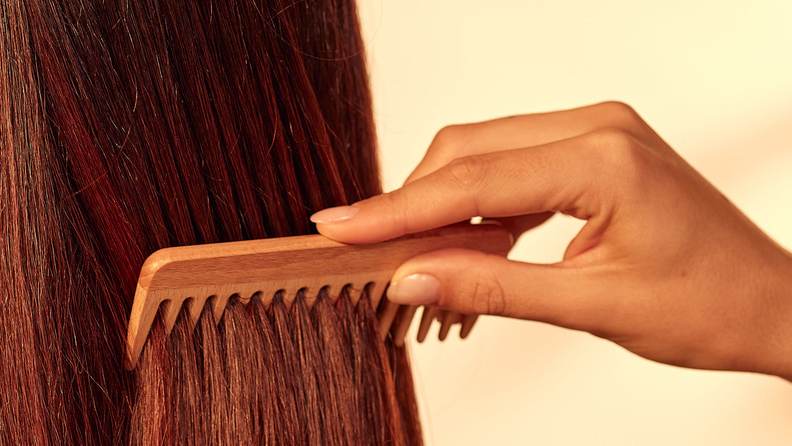woman using khadi ayurvedic conditioners