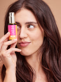 A model presenting khadi natural hair oil
